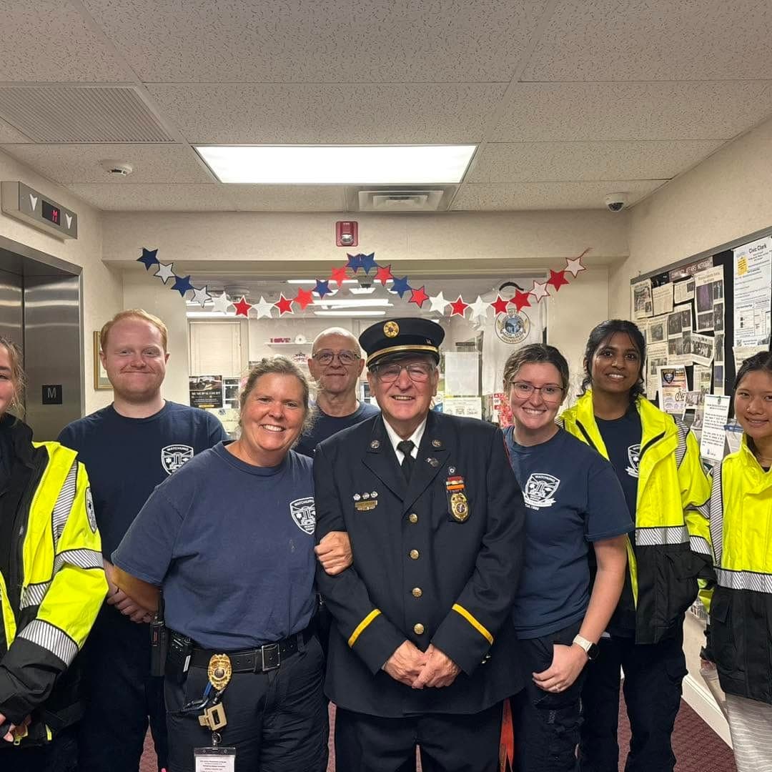 Greves poses with members of the Watchung Fire Department, whom he has mentored throughout his decades of service.