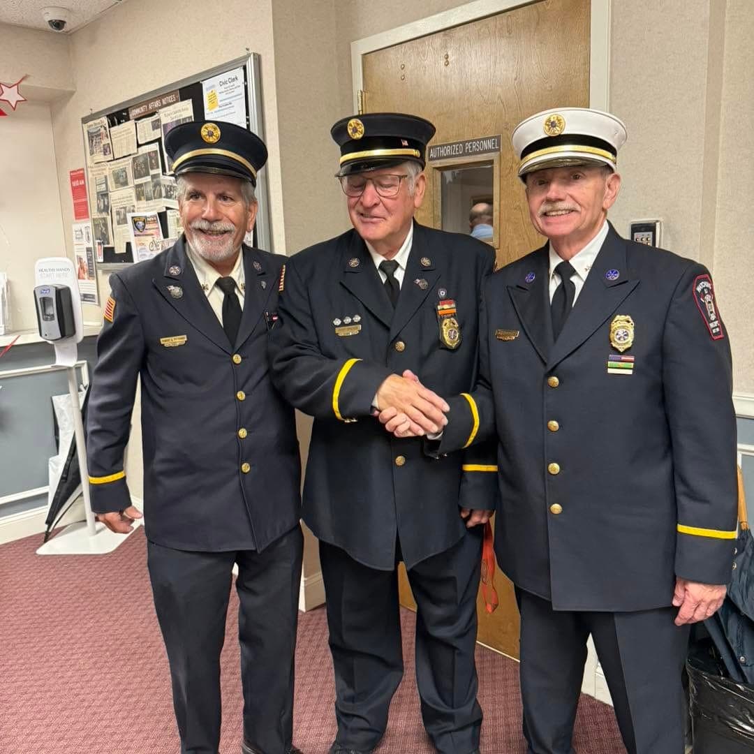 Greves shakes hands with fellow department officers following the recognition.