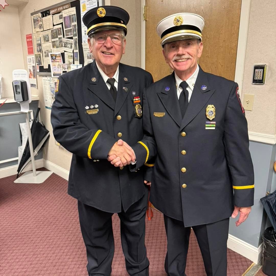 A closer look at Greves' handshake with fellow department officers.